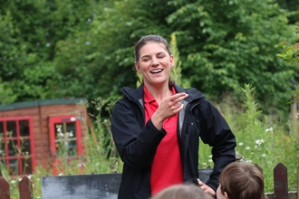 Education Officer Toni with children