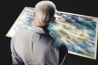 Sir David Attenborough and map