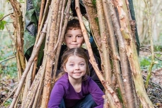 smiling children in a den 