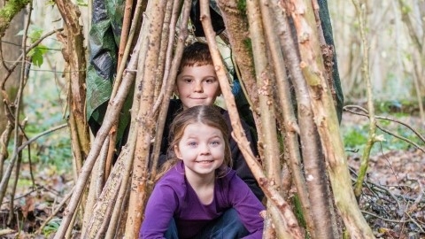 smiling children in a den 