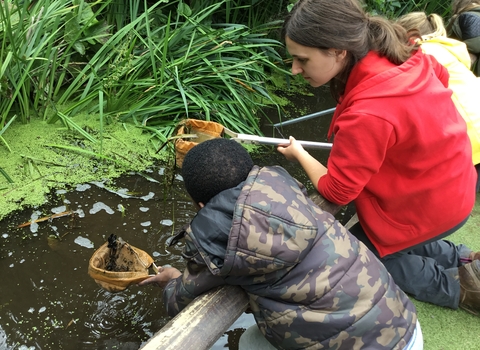 Education Officer Naomi pond dipping Paula Irish